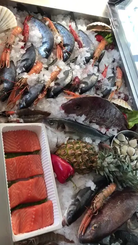Fresh fish, prawns and salmon on crushed ice at the Marina Fish House counter